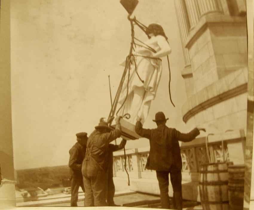 Nils Nelson (probably) supervising setting one of Six Virtues statues