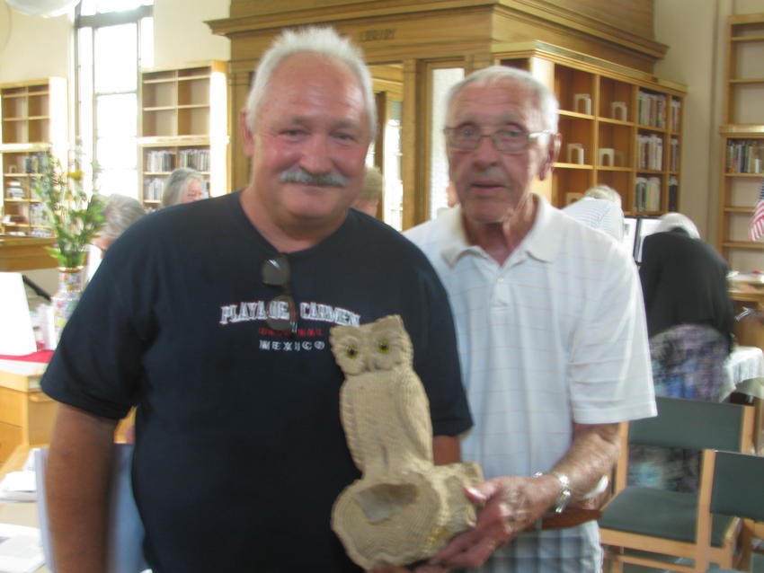 John Meyer's descendants showing owl he carved